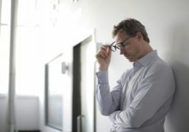 man holding head, headache, migraine